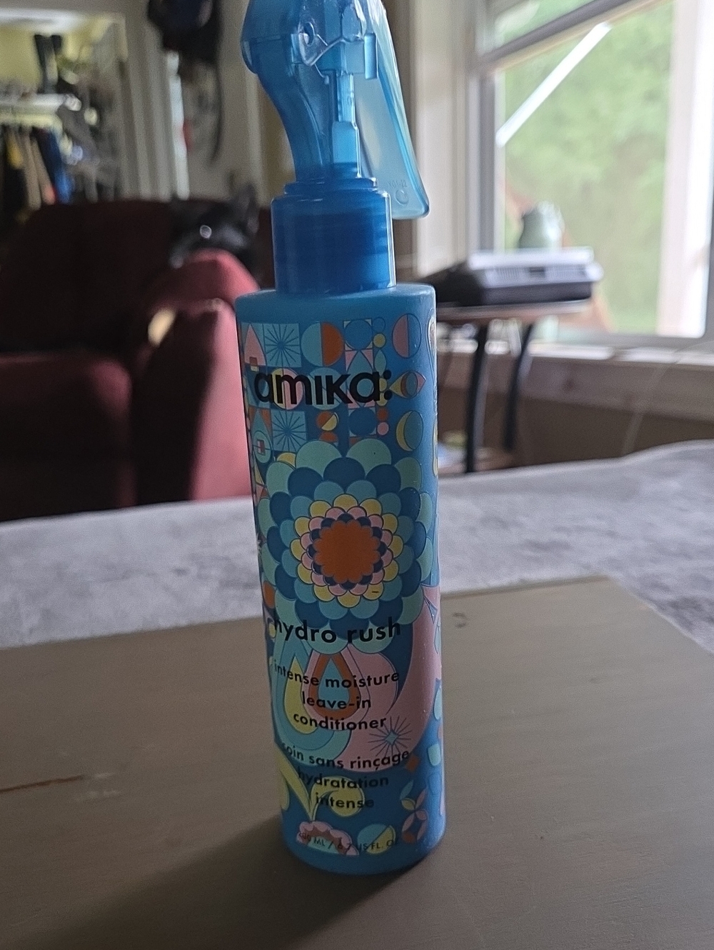 amika Hydro Rush Leave-In Conditioner Spray in Blue with Multicolor Pattern